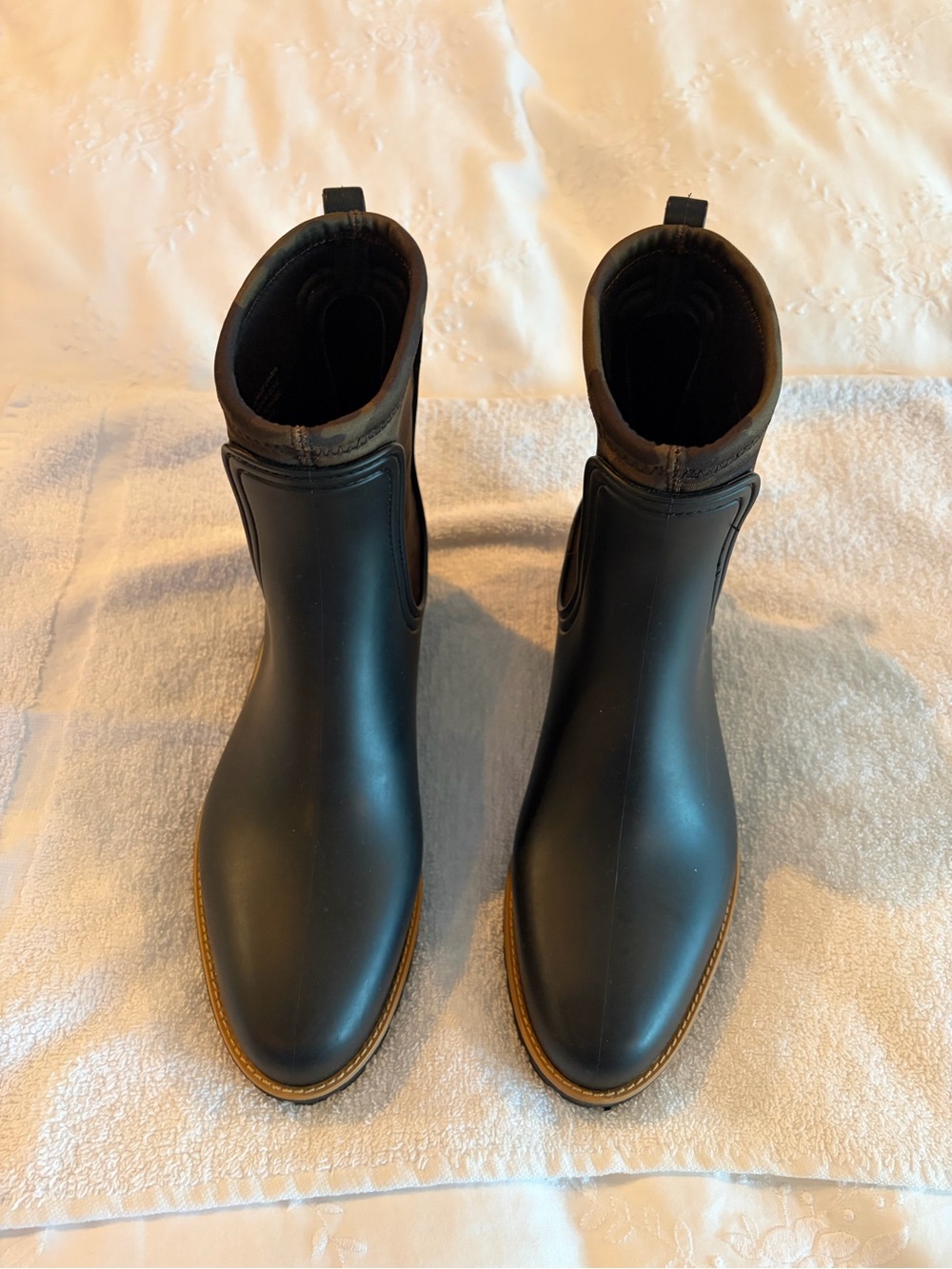 Bernardo Black Ankle Rain Boots with camo accents.